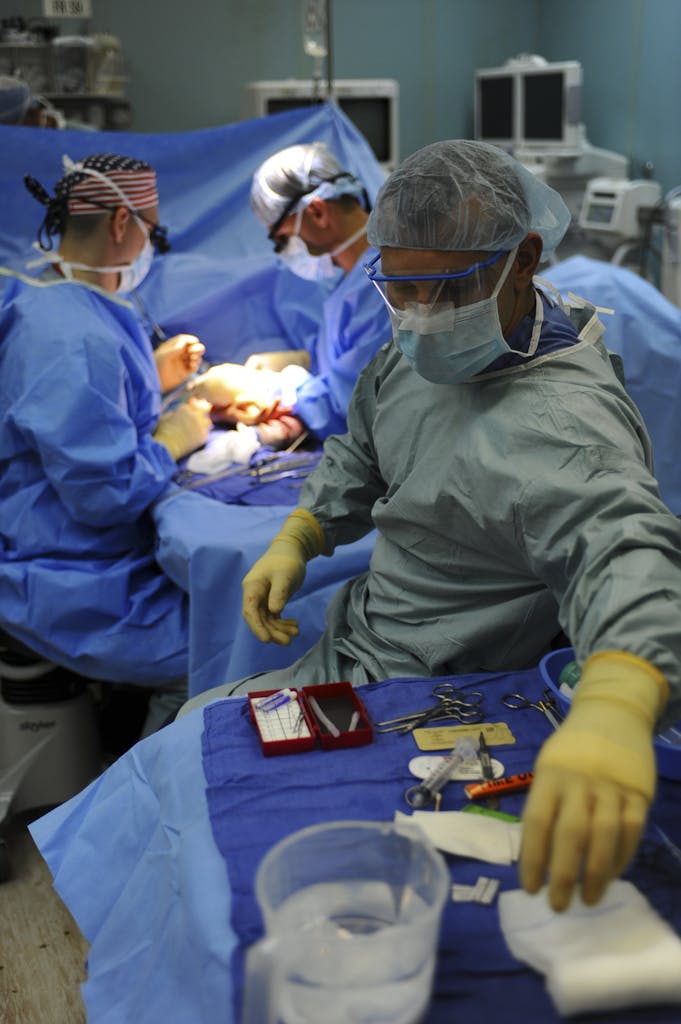 Group of Doctors Doing Operation Inside Room